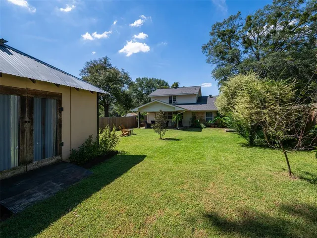 a view of a chair and table under an umbrella