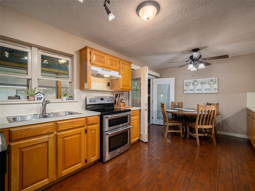 808 Walters Frankston, TX 75763 - Photo 8 of 32 a kitchen with a table chairs stove and sink