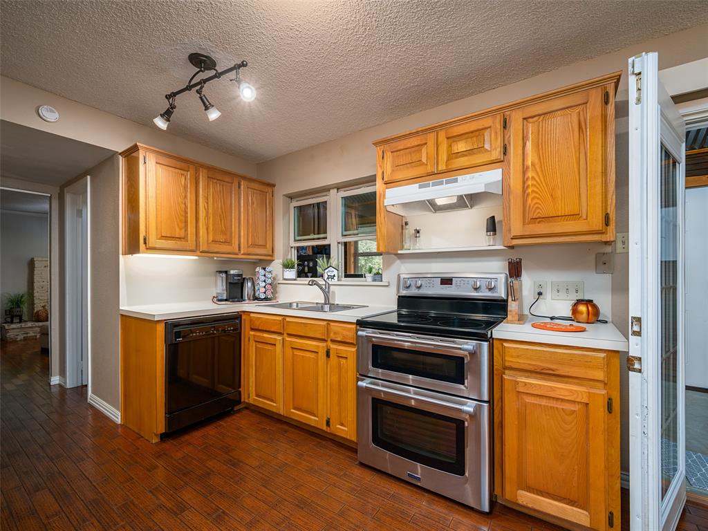 808 Walters Frankston, TX 75763 - Photo 9 of 32 a kitchen with stainless steel appliances granite countertop a stove and a refrigerator