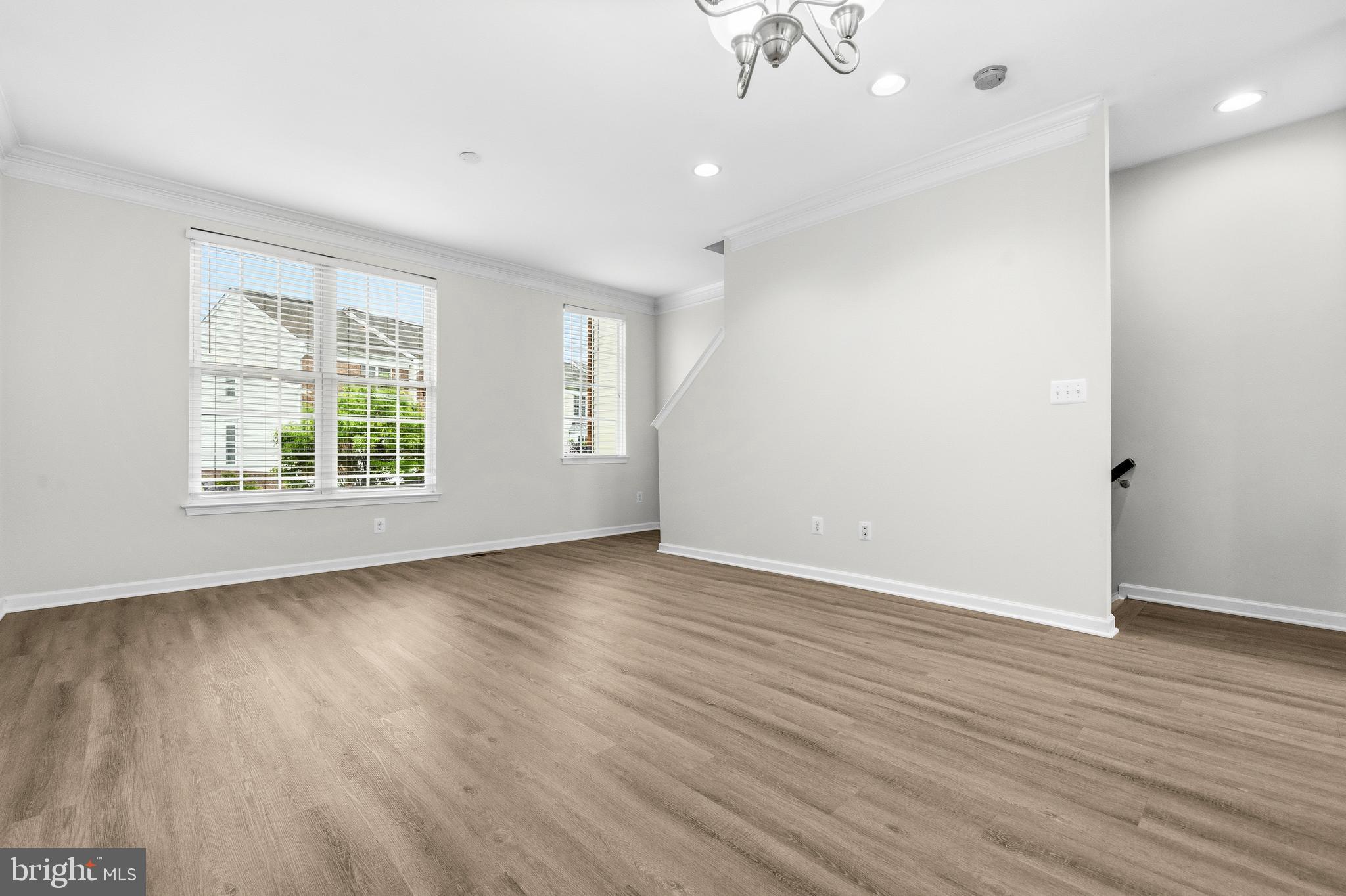 25154 Monteith Terrace Chantilly, VA 20152 - Photo 5 of 40 an empty room with wooden floor and windows