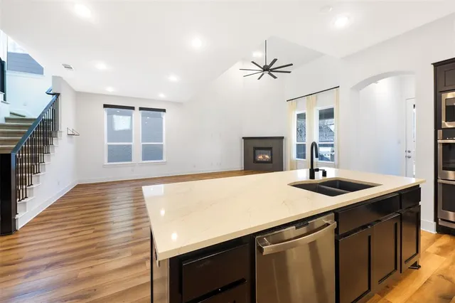 a kitchen with a sink and a refrigerator