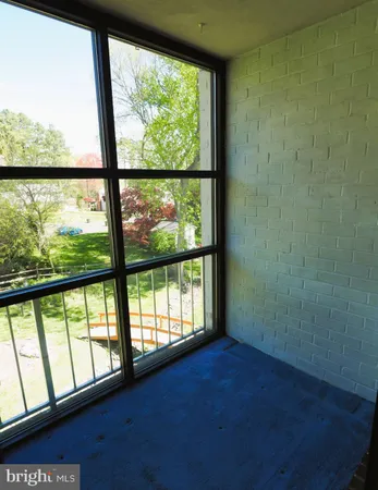 a view of front door with wooden floor