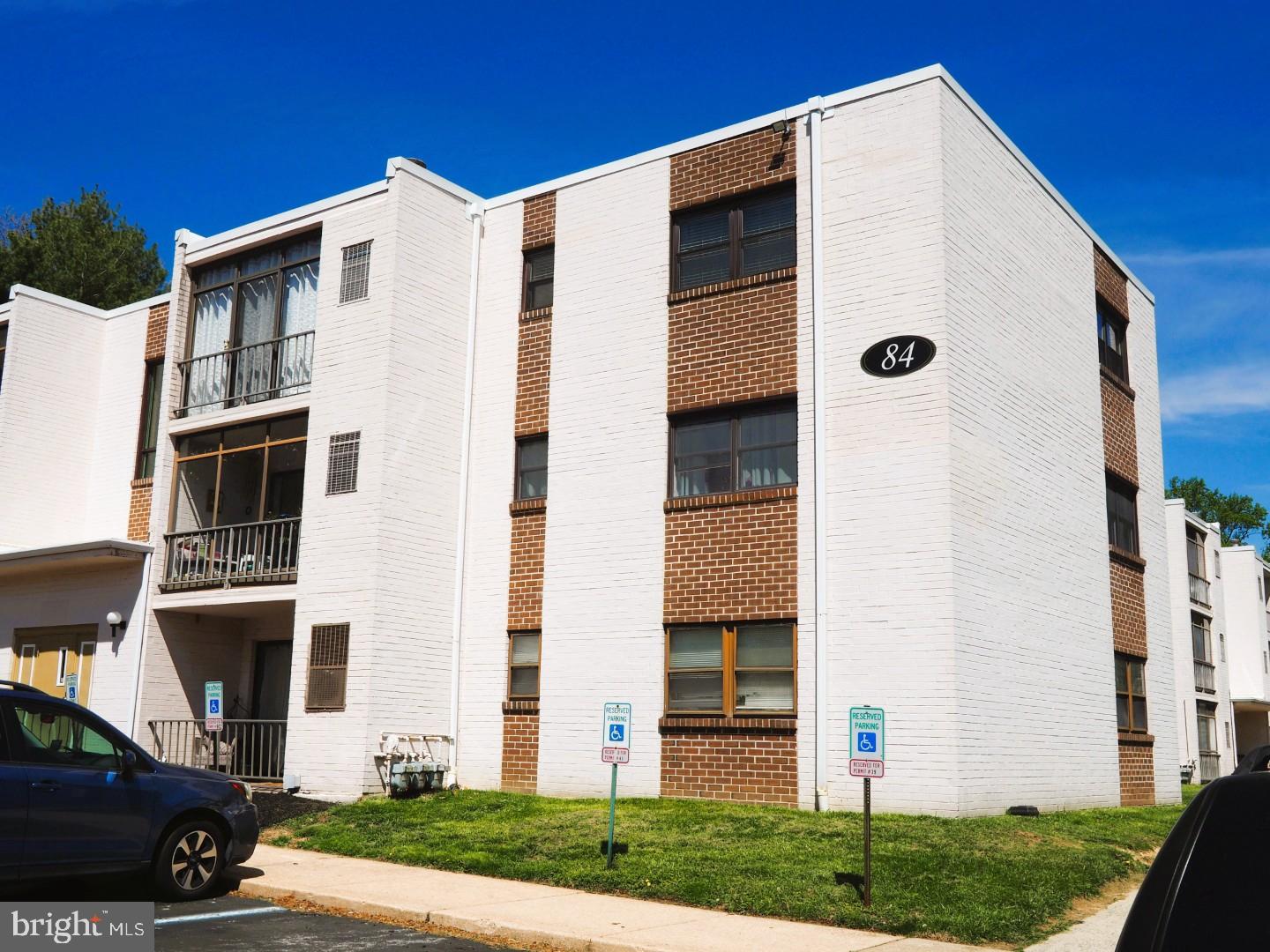 84 Welsh Tract Road, Unit 311 Newark, DE 19713 - Photo 22 of 25 a front view of a house with a yard