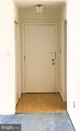 a view of an empty room and window