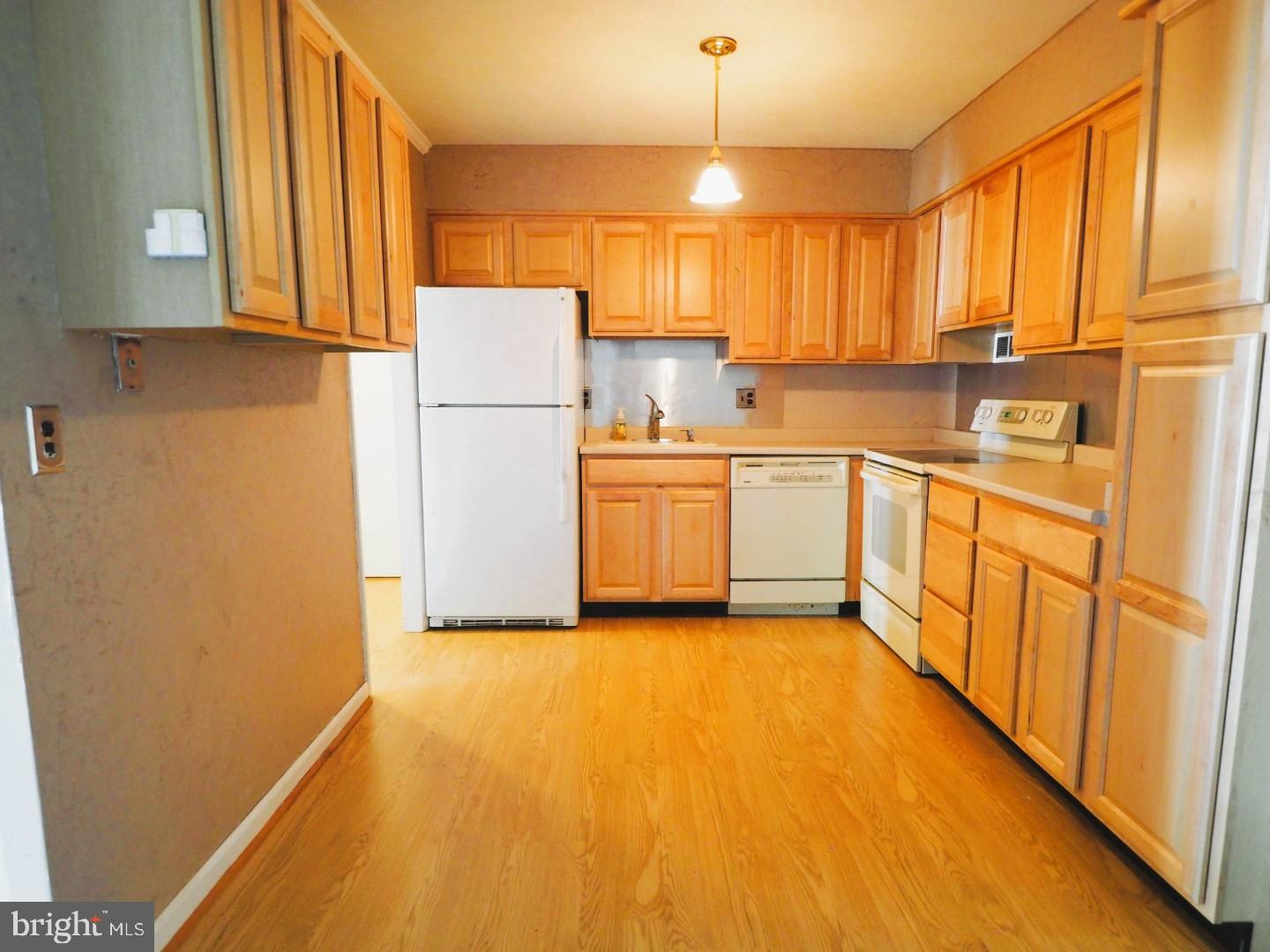 84 Welsh Tract Road, Unit 311 Newark, DE 19713 - Photo 6 of 25 a kitchen with stainless steel appliances a refrigerator sink and cabinets