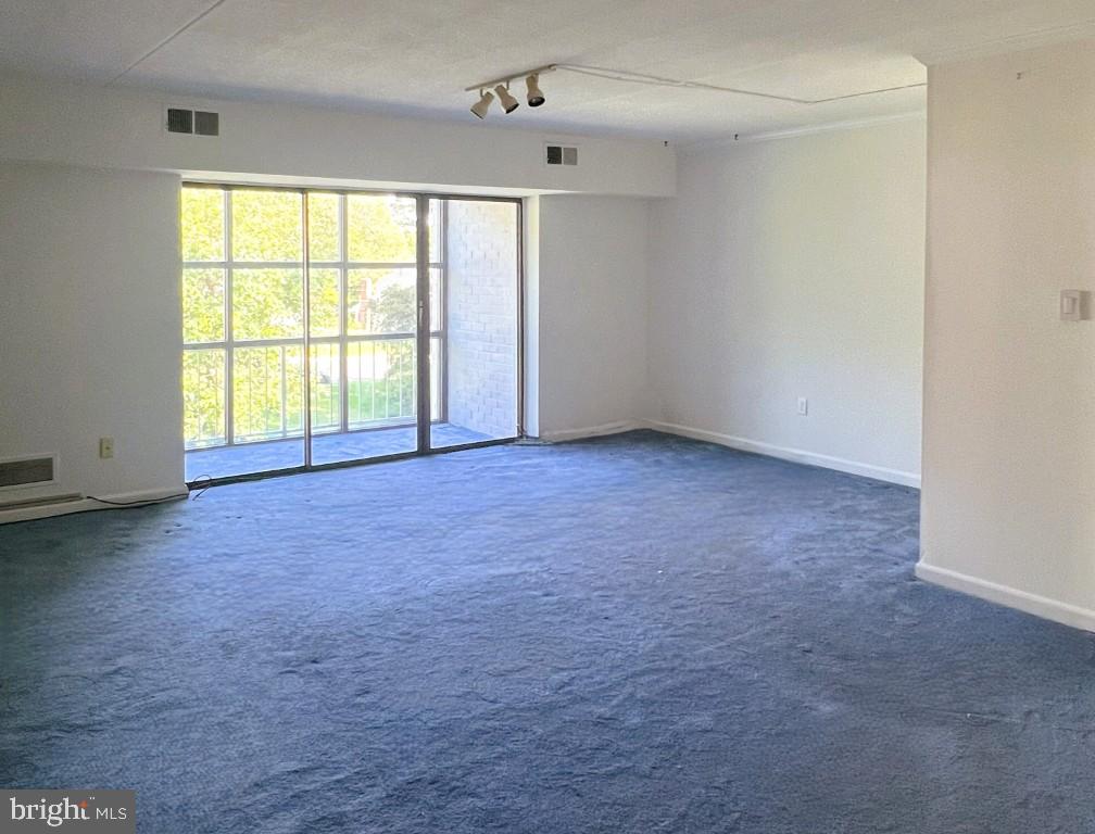 84 Welsh Tract Road, Unit 311 Newark, DE 19713 - Photo 9 of 25 an empty room with windows
