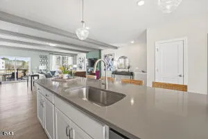a kitchen with stainless steel appliances granite countertop a sink a oven and a refrigerator