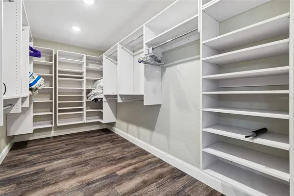 a bathroom with a granite countertop toilet sink and a mirror