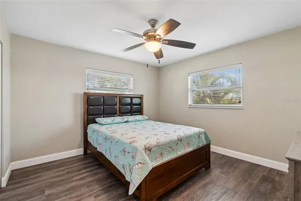 a kitchen with a refrigerator sink and cabinets