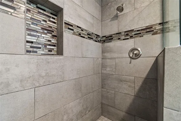 a en suite bathroom with a sink and a mirror