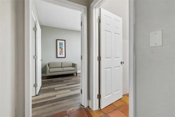 a room with pool table and glass door