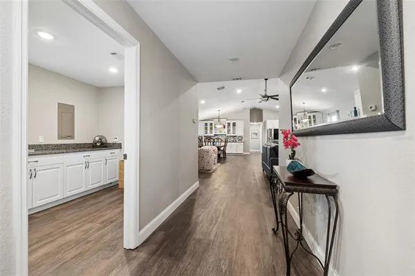 a living room with furniture and a ceiling fan