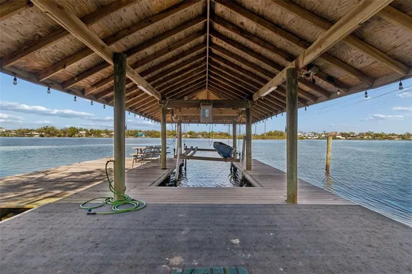 an aerial view of a houses with a lake view