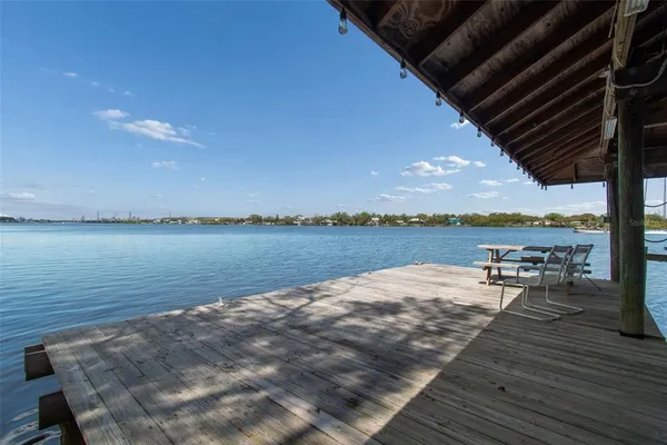 an aerial view of residential houses with outdoor space and swimming pool