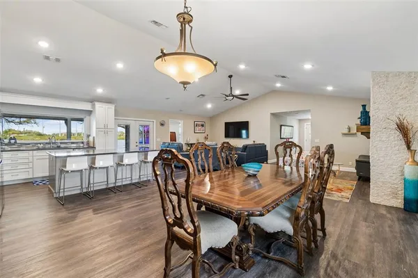 a kitchen with stainless steel appliances a stove a sink and a refrigerator
