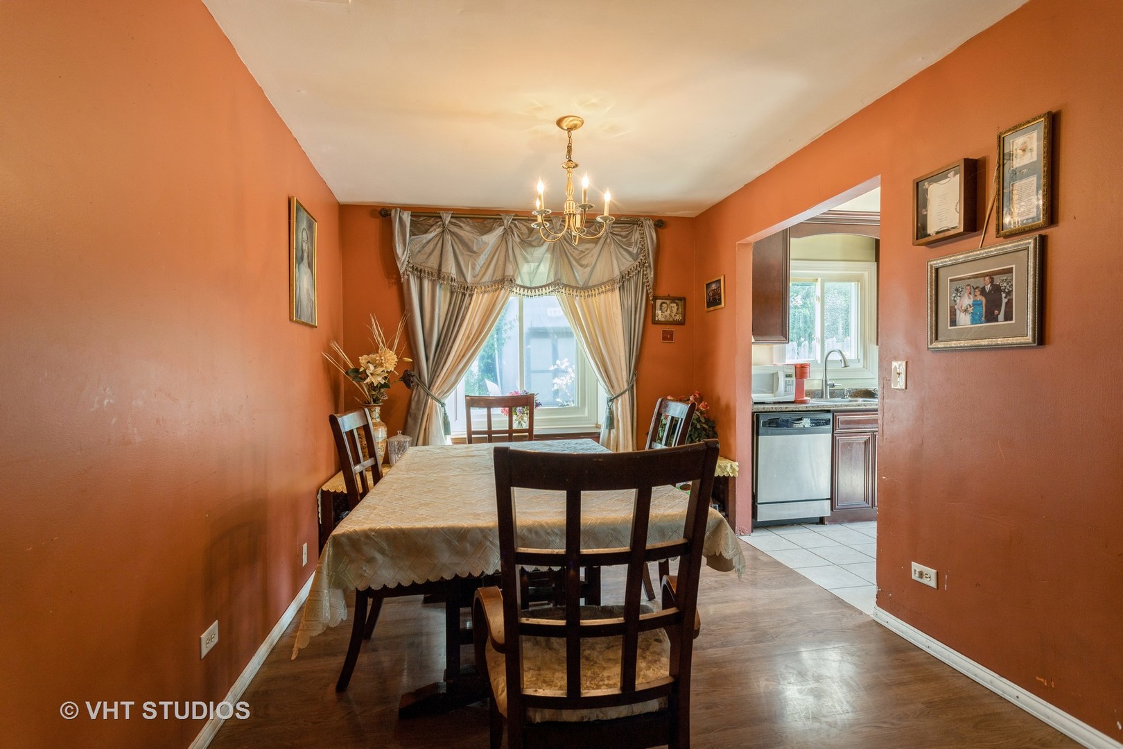 267 Westbrook Circle Naperville, IL 60565 - Photo 7 of 12 a view of a dining room with furniture window and wooden floor