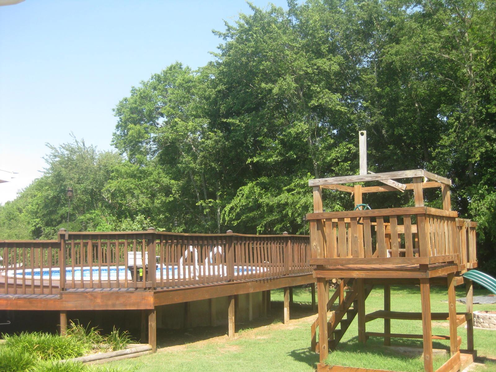 300 Rachel Road Pulaski, TN 38478 - Photo 2 of 28 Above ground pool with deck all around it. Play gym remains with property. More photos to come