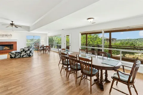 a dining room with furniture window and wooden floor