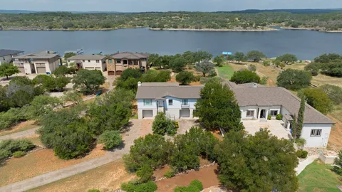 an aerial view of a house with a lake view