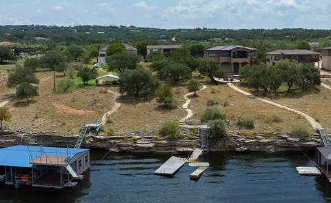 an aerial view of a house with a yard