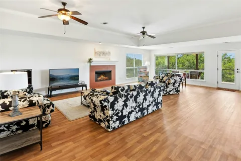 a living room with furniture fireplace and flat screen tv