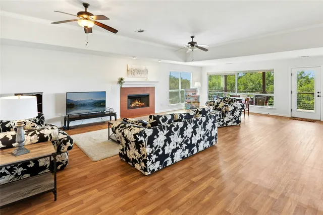 a living room with furniture fireplace and flat screen tv