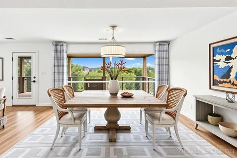 a view of a dining room with furniture window and outside view