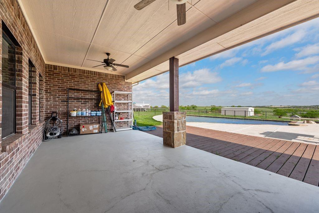 461 Pearson Ranch Road Azle, TX 76020 - Photo 35 of 39 This patio was set up with ceiling fans, and plenty of room for your outdoor entertainment.