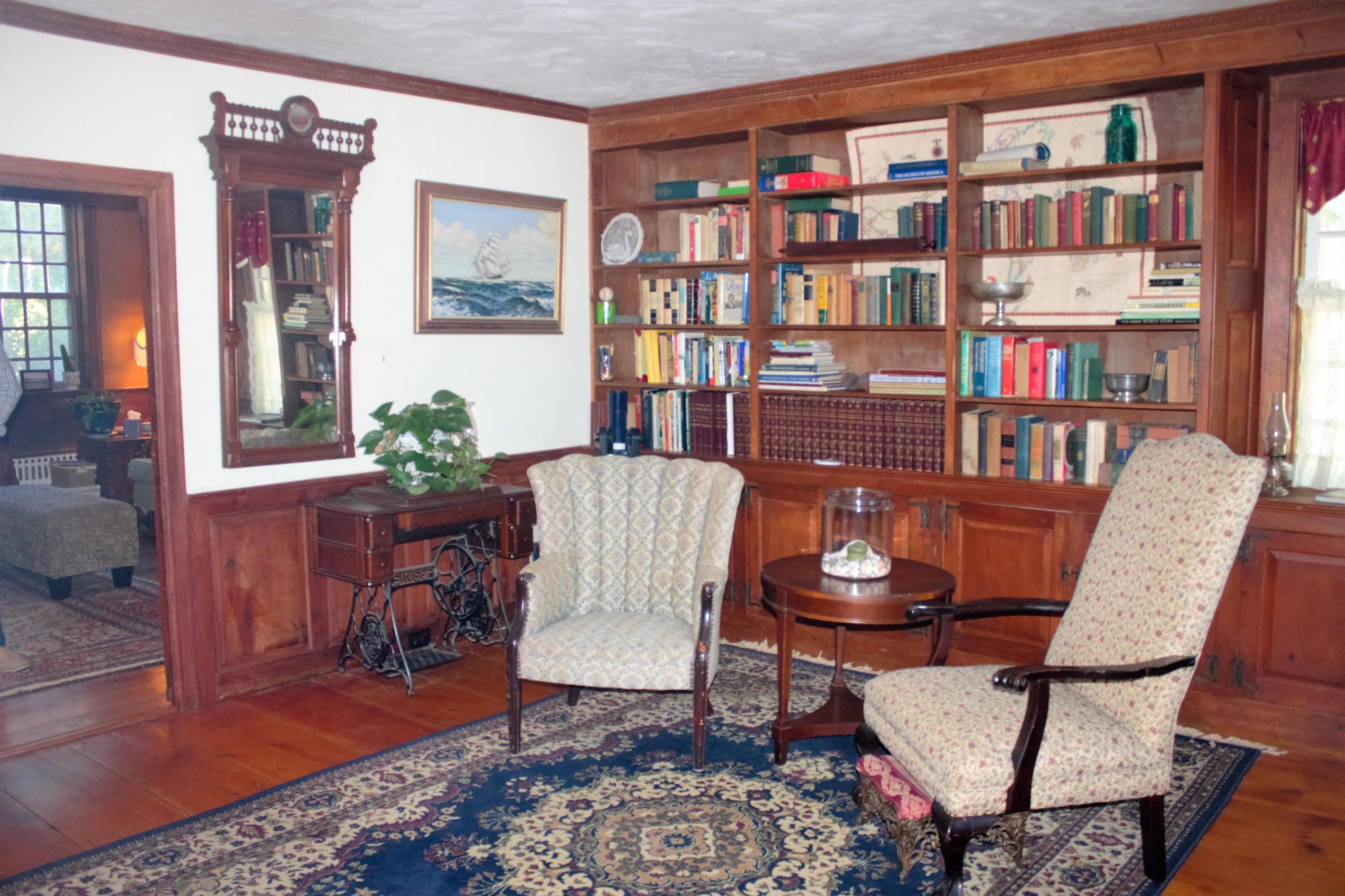 520 Main Street Wareham, MA 02571 - Photo 16 of 32 a living room with furniture and a book shelf