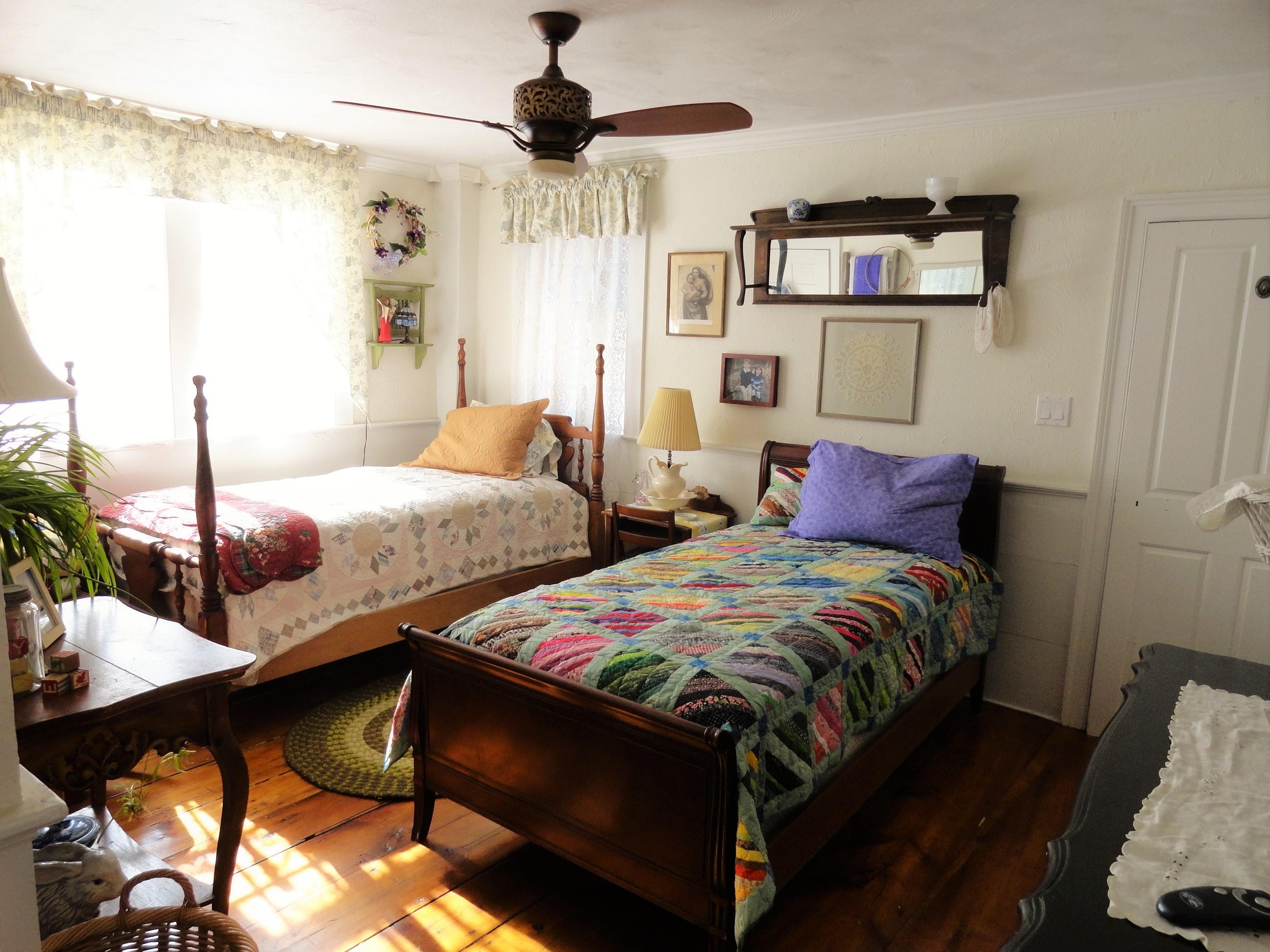 520 Main Street Wareham, MA 02571 - Photo 18 of 32 a bedroom with two beds and a chandelier