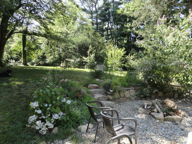 520 Main Street Wareham, MA 02571 - Photo 28 of 32 a backyard of a house with lots of green space and a fountain