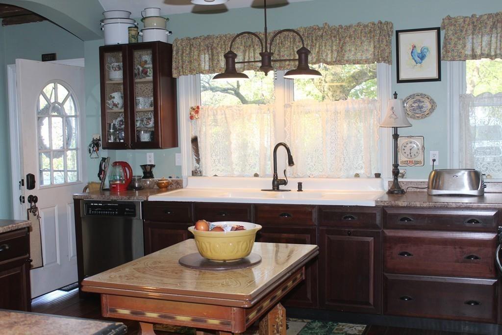 520 Main Street Wareham, MA 02571 - Photo 4 of 32 a kitchen with a sink and chandelier