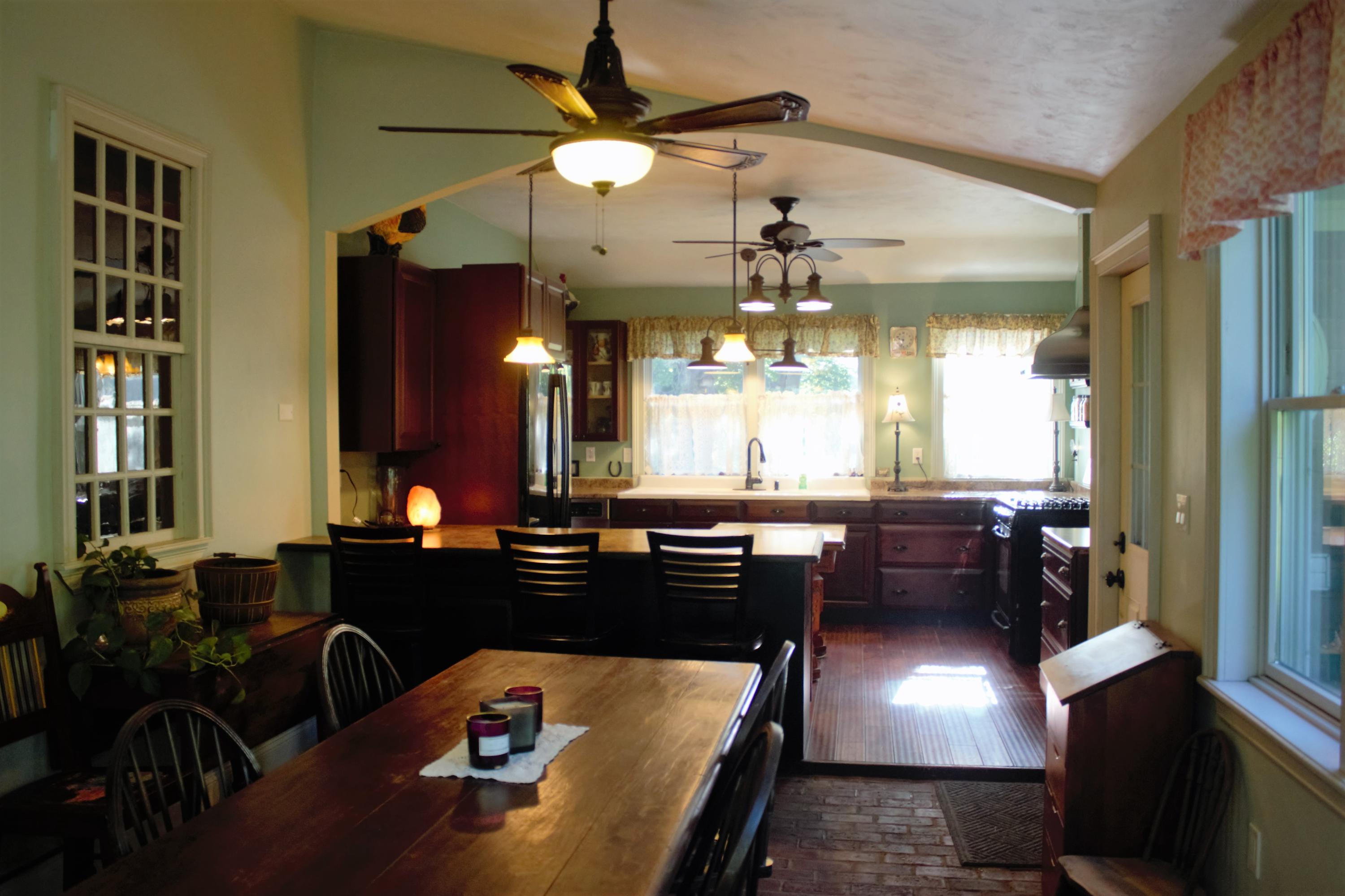 520 Main Street Wareham, MA 02571 - Photo 7 of 32 a kitchen with a table chairs and a chandelier