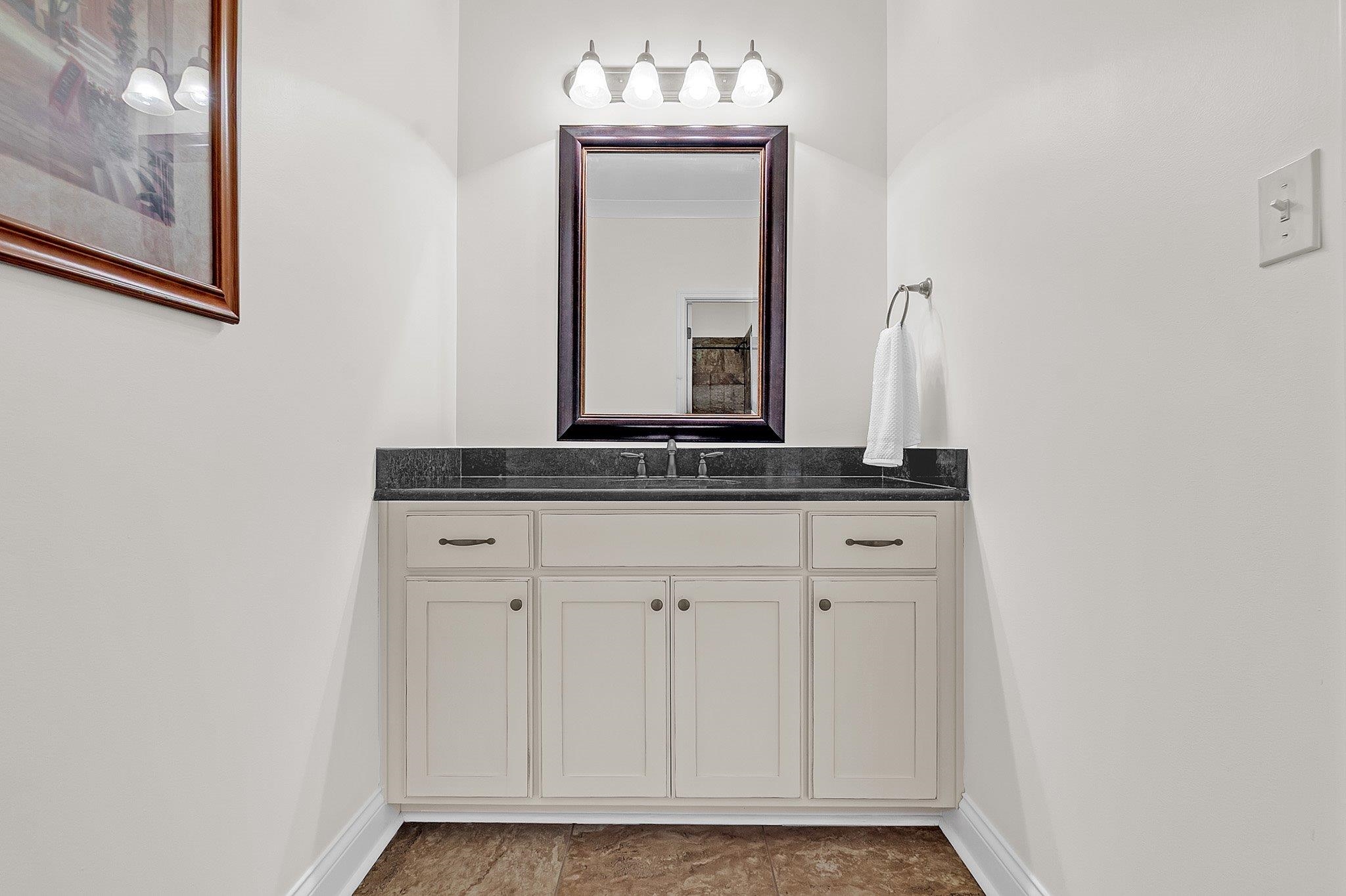3246 North Hartwell Ridge Drive Collierville, TN 38017 - Photo 32 of 40 White vanity with dark stone countertop and integrated sink