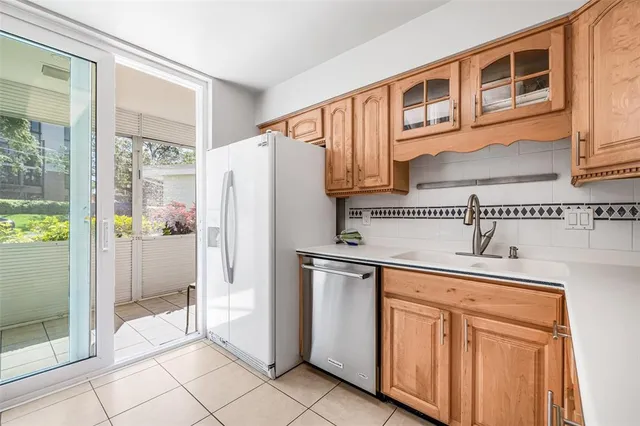 a kitchen with stainless steel appliances a refrigerator and a stove