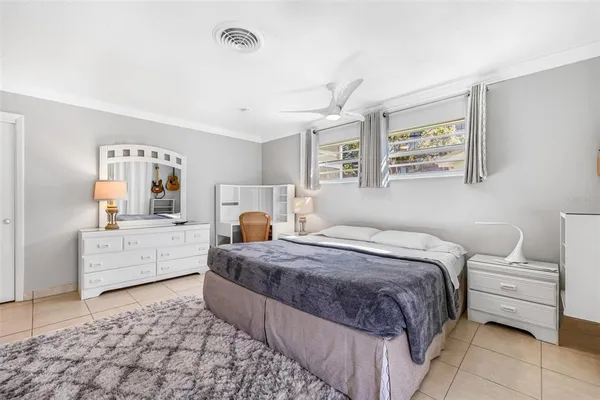 a room with a bed and a dresser