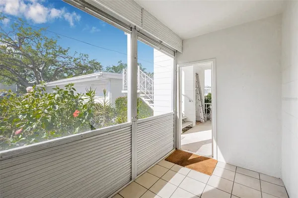 a view of a balcony with wooden floor
