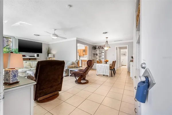 a work room with furniture and a flat screen tv
