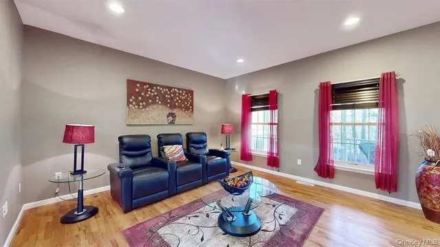 a living room with furniture or window and a wooden floor