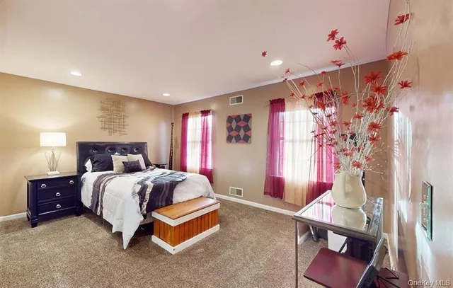 a bed room with a bed and a chair