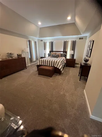 a bed room with furniture and a window