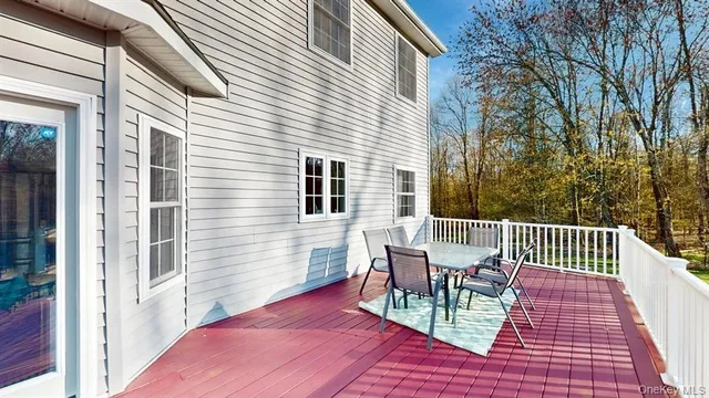 a view of a chair and table in the balcony