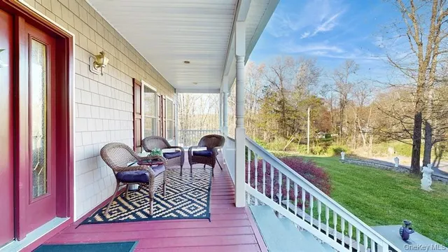 a view of balcony with furniture