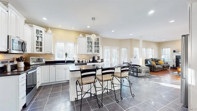 a kitchen with counter space dining table furniture and a view of dining table