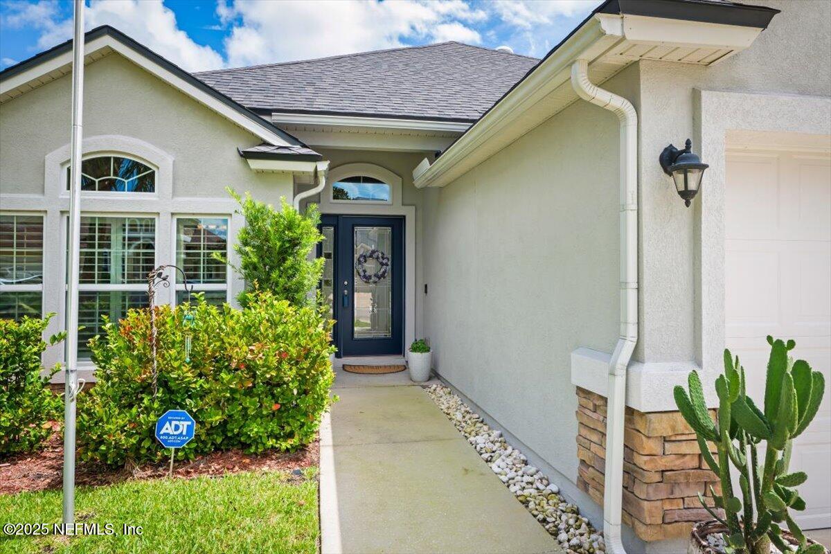 486 Porta Rosa Circle St. Augustine, FL 32092 - Photo 2 of 38 a front view of a house with garden