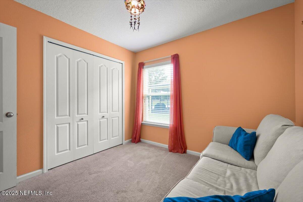 486 Porta Rosa Circle St. Augustine, FL 32092 - Photo 28 of 38 a living room with furniture and a window