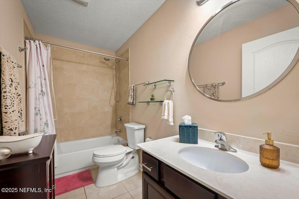 486 Porta Rosa Circle St. Augustine, FL 32092 - Photo 29 of 38 a bathroom with a sink a toilet and shower