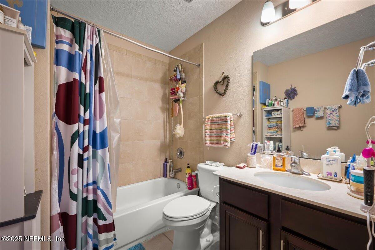 486 Porta Rosa Circle St. Augustine, FL 32092 - Photo 32 of 38 a bathroom with a sink toilet tub and shower