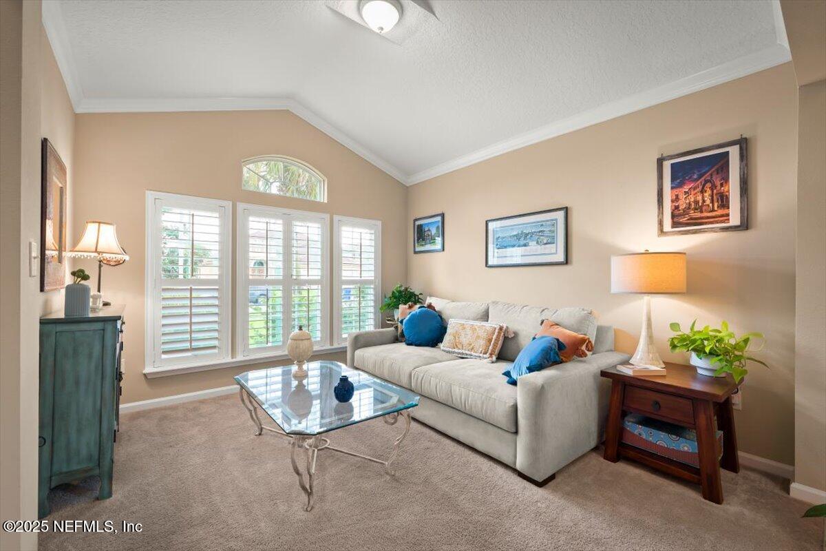 486 Porta Rosa Circle St. Augustine, FL 32092 - Photo 4 of 38 a living room with furniture and a large window