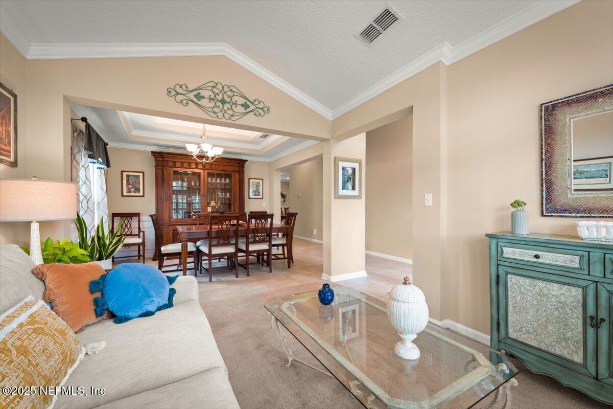 486 Porta Rosa Circle St. Augustine, FL 32092 - Photo 5 of 38 a living room with furniture and wooden floor
